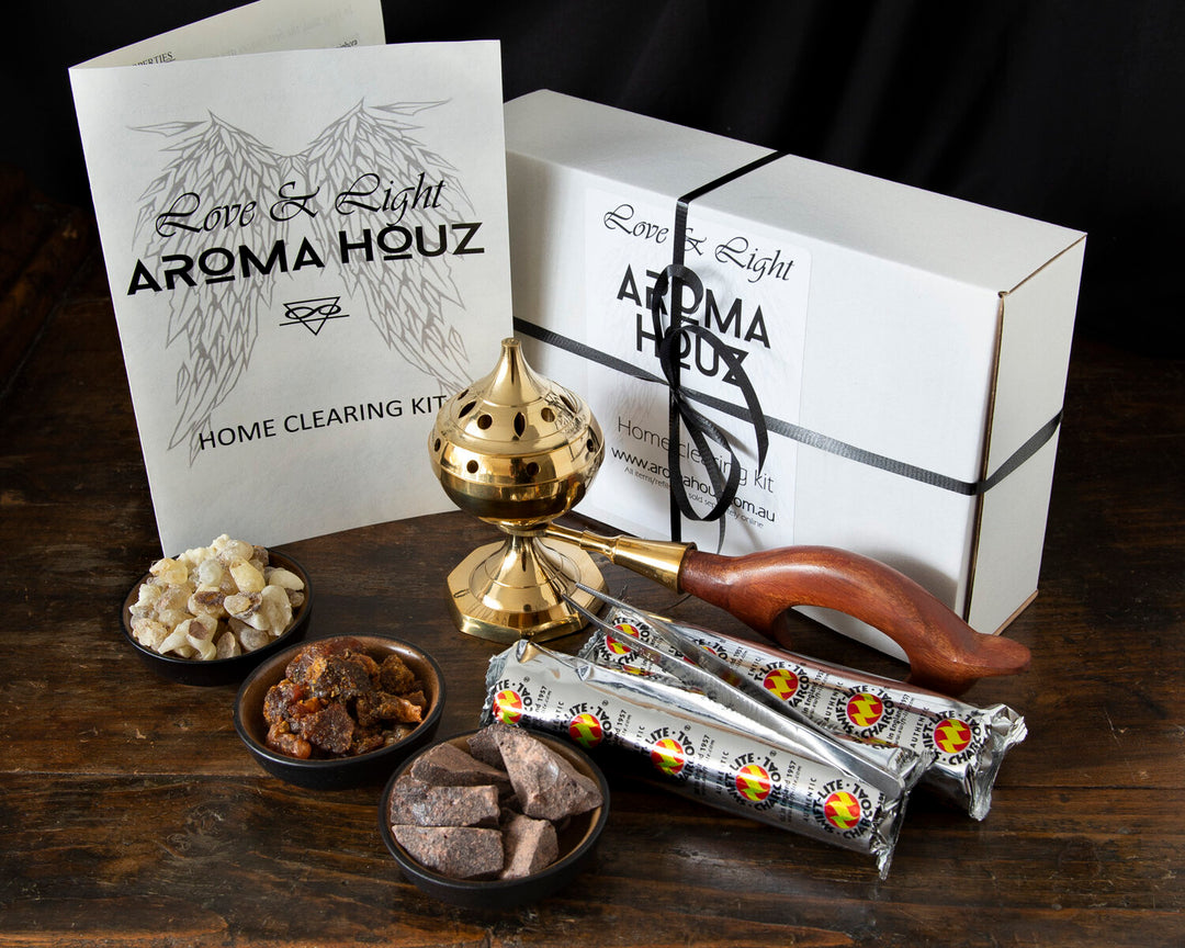 Aroma Houz home cleansing kit with incense and smudging tools on wooden surface