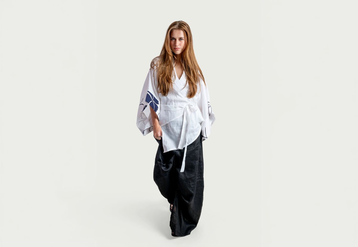 Woman in a white kimono-styled piece